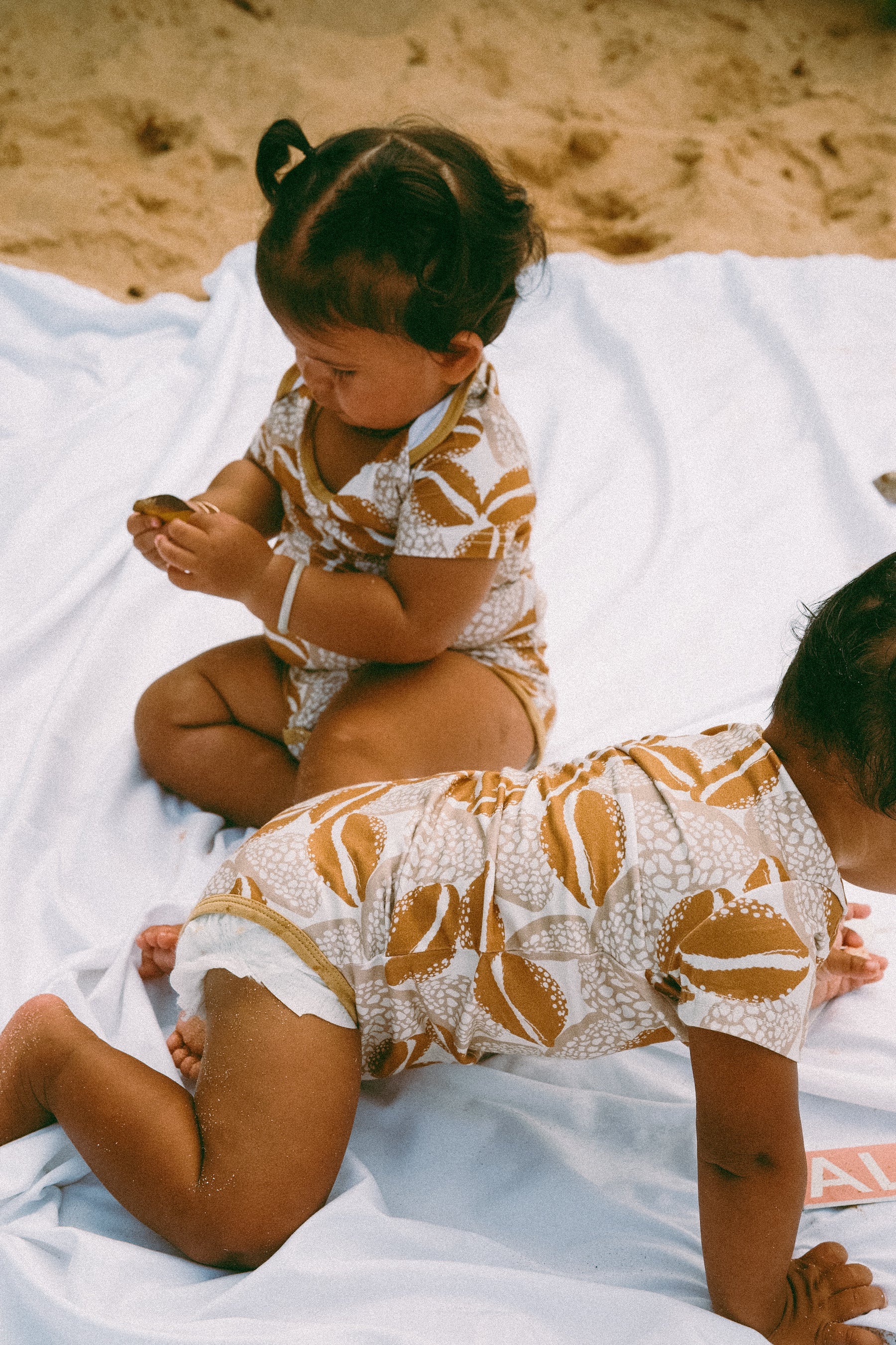 Cowrie onesie