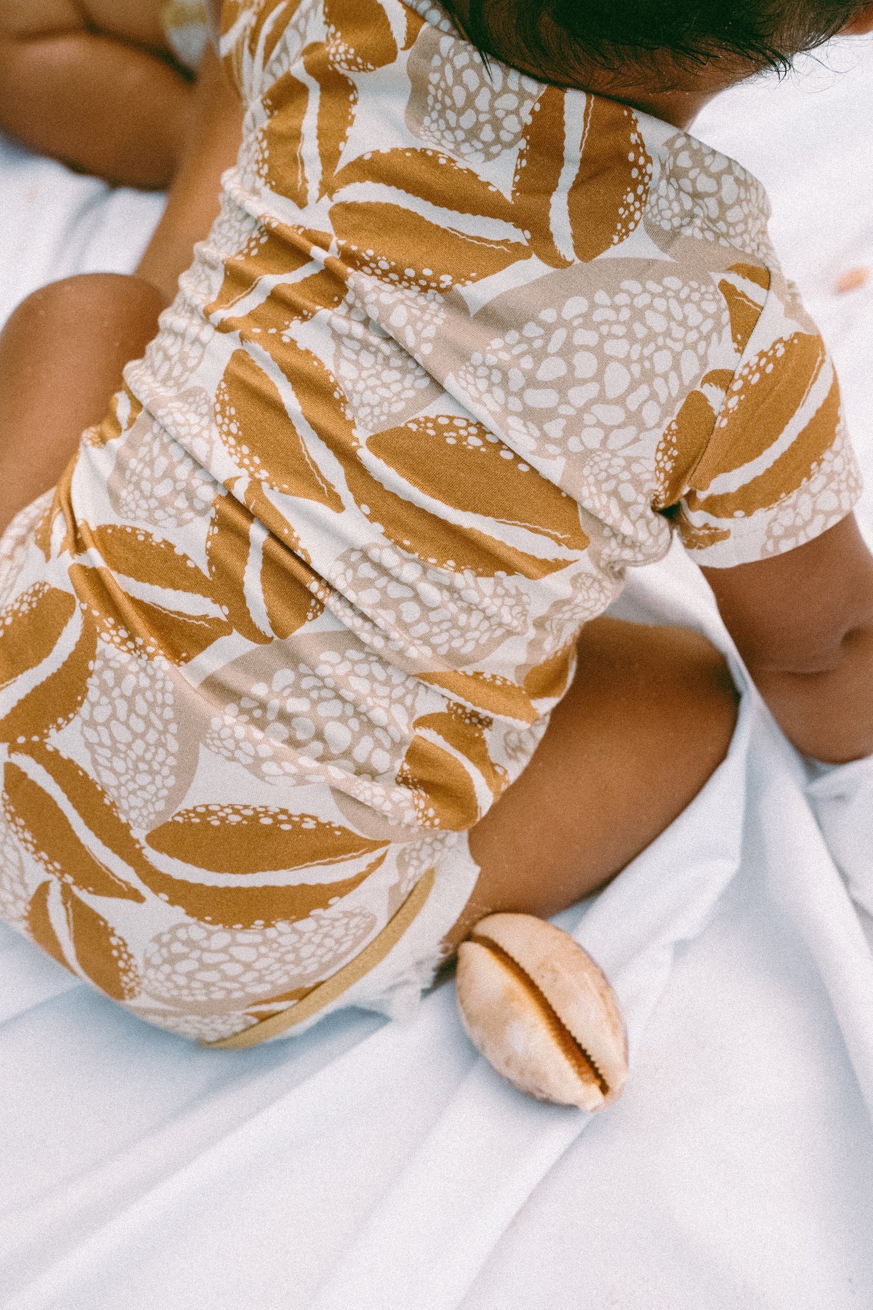 Cowrie onesie