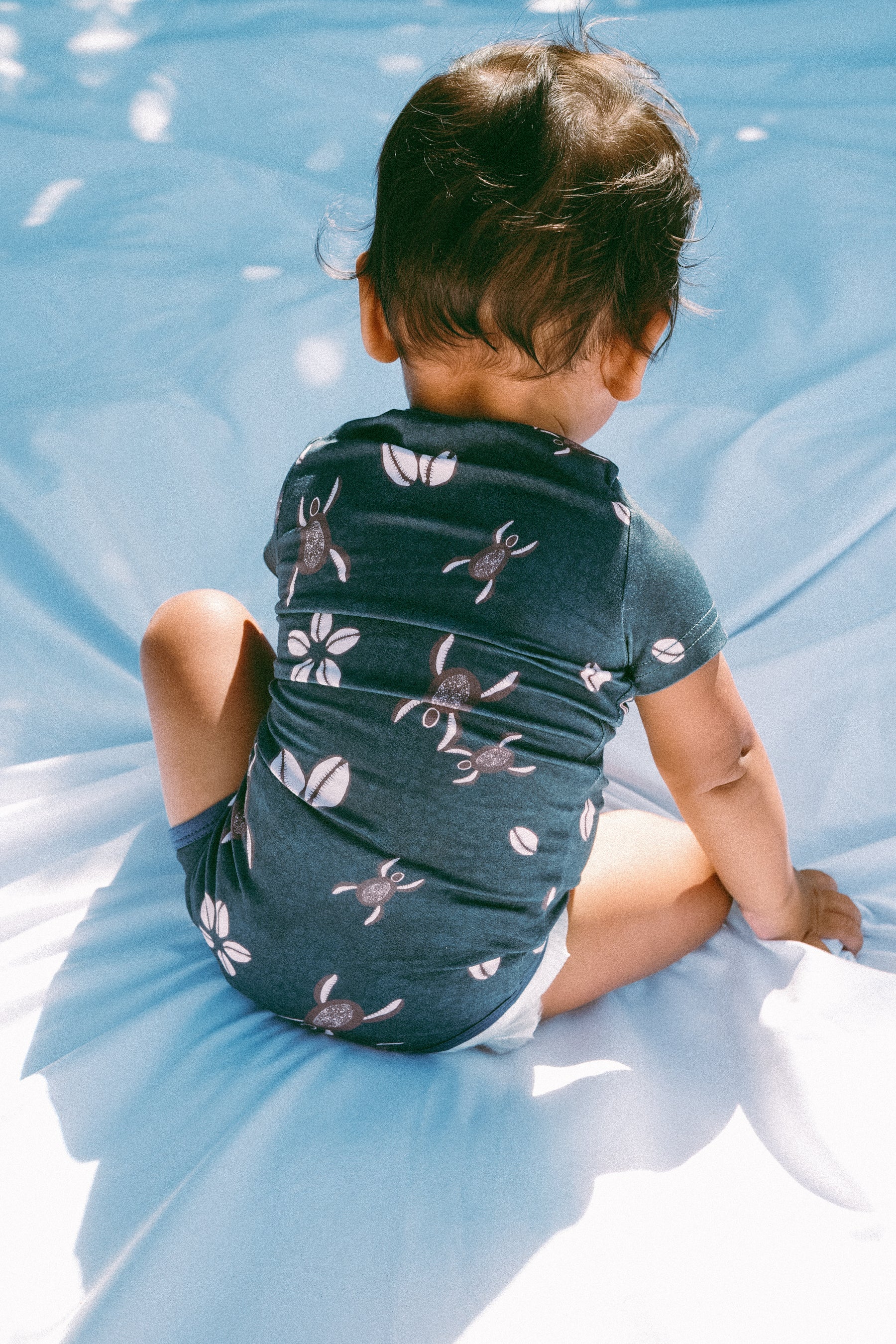 Blue Honu Cowrie onesie