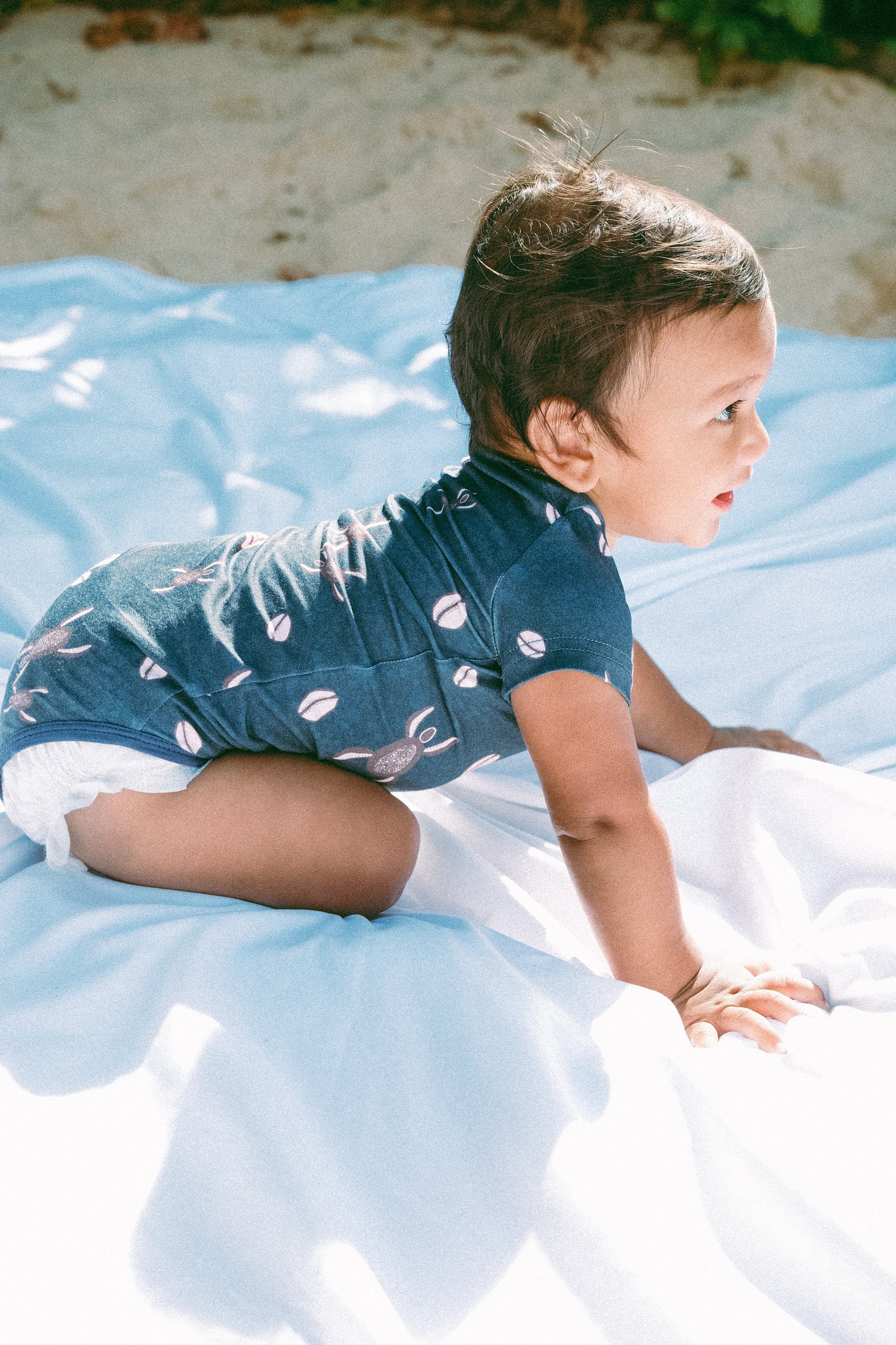 Blue Honu Cowrie onesie
