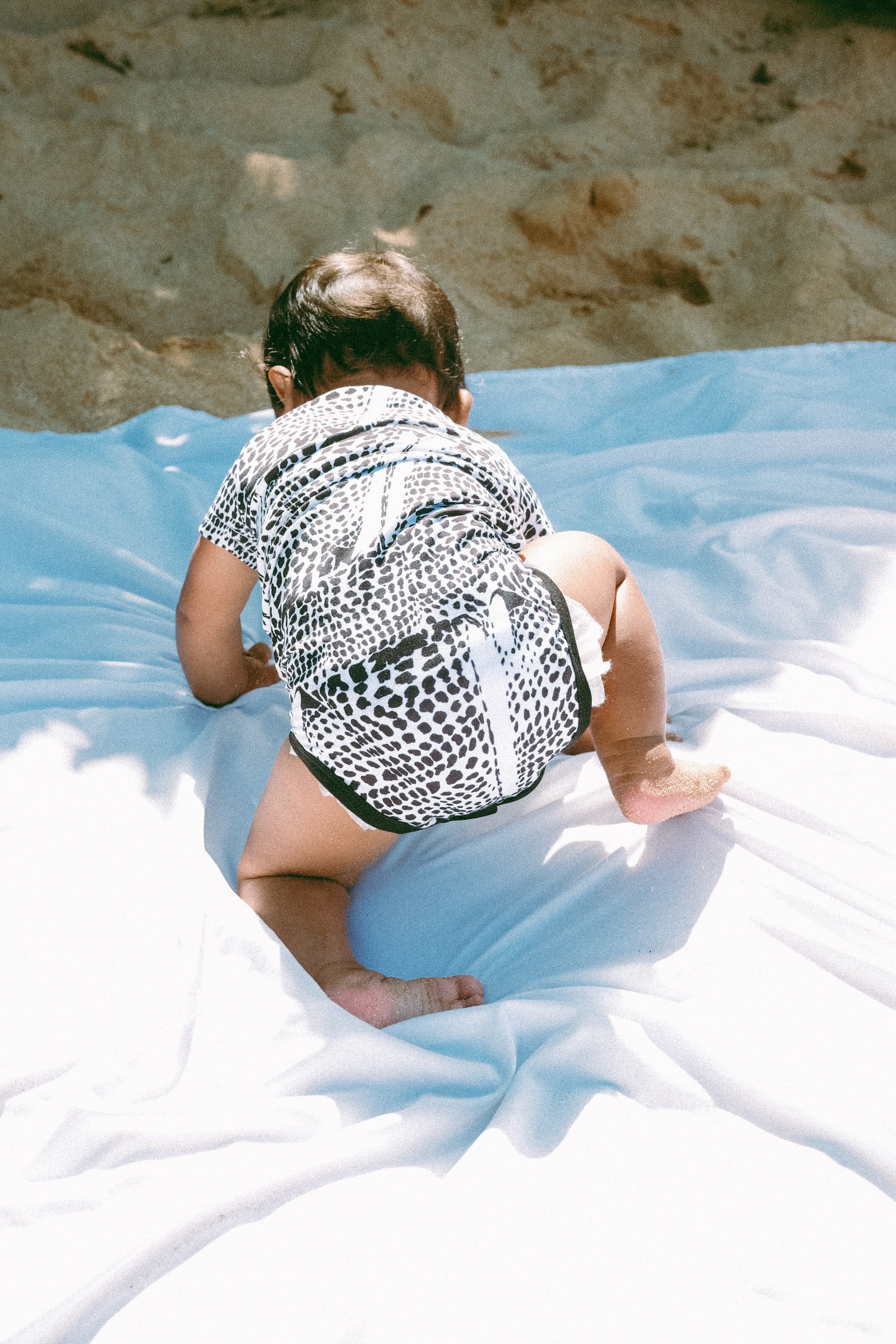 Leopard cone shell onesie