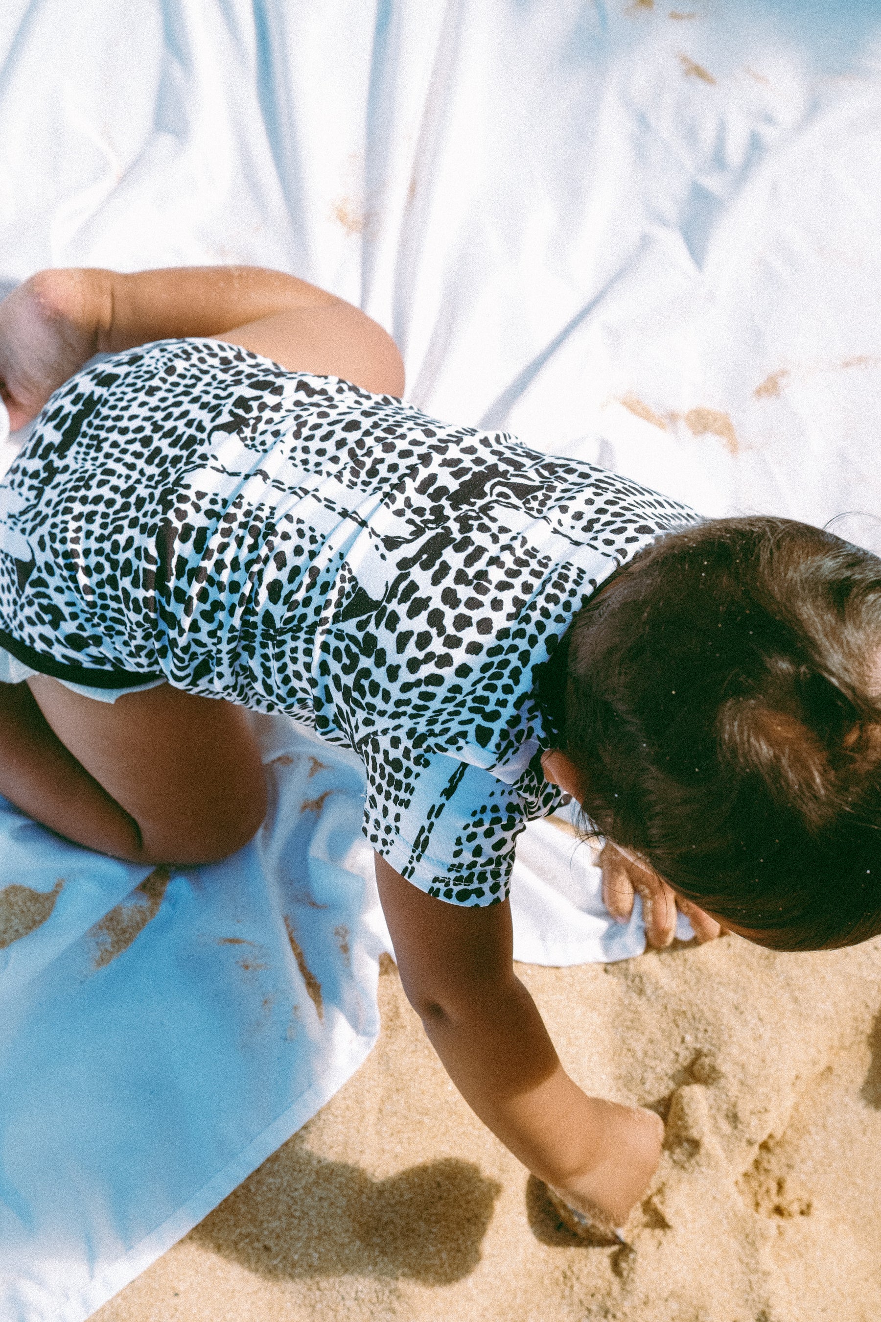 Leopard cone shell onesie