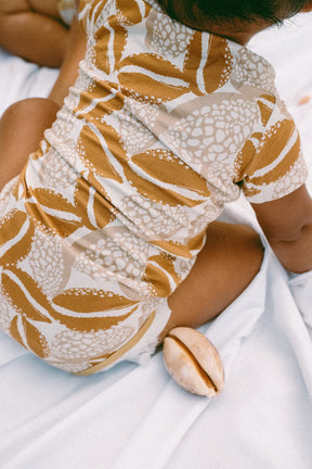 Cowrie onesie