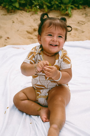 Cowrie onesie